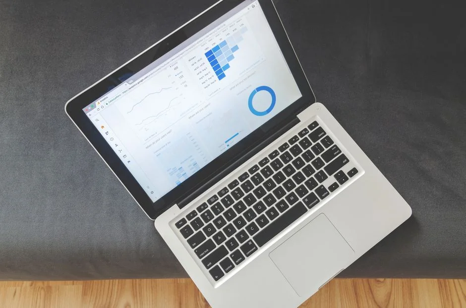 Person analyzing cryptocurrency data using a laptop, highlighting financial insights.